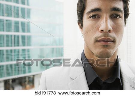 Close up of Hispanic businessman looking serious View Large Photo Image Stock Photo - Close up of Hispanic businessman looking serious. Fotosearch