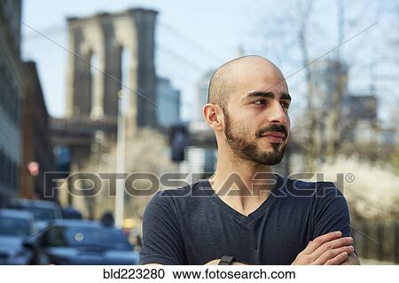 Close up of Hispanic man with arms crossed View Large Photo Image Stock Image - Close up of Hispanic man with arms crossed. Fotosearch