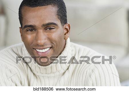 Stock Photograph - Close up of Indian man smiling. Fotosearch