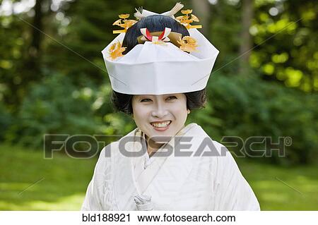Stock Image - Close up of Japanese bride wearing traditional clothing. Fotosearch