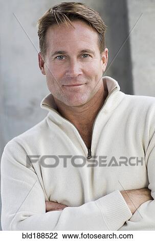 Close up of man with arms crossed View Large Photo Image Stock Image - Close up of man with arms crossed. Fotosearch