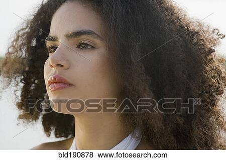 Close up of serious Hispanic woman View Large Photo Image Stock Photo - Close up of serious Hispanic woman. Fotosearch
