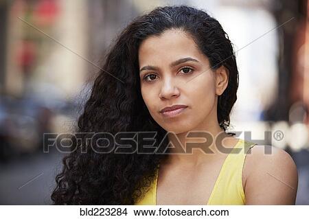 Close up of serious Mixed Race woman View Large Photo Image Picture - Close up of serious Mixed Race woman. Fotosearch