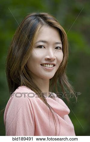 Close up of smiling Asian woman View Large Photo Image Stock Image - Close up of smiling Asian woman. Fotosearch