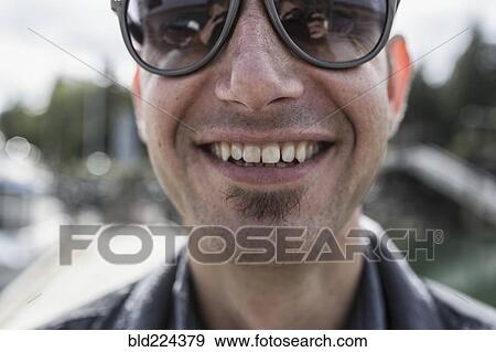Stock Photo - Close up of smiling Caucasian man with soul patch. Fotosearch