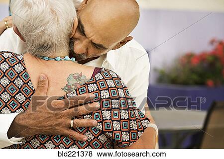 Couple hugging outdoors View Large Photo Image Stock Photo - Couple hugging outdoors. Fotosearch