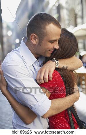 Couple hugging outdoors View Large Photo Image Stock Photograph - Couple hugging outdoors. Fotosearch