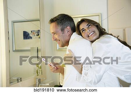 Couple in bathrobes hugging View Large Photo Image Stock Image - Couple in bathrobes hugging. Fotosearch