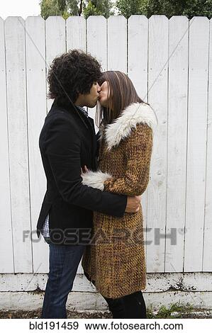 Couple in retro clothing kissing View Large Photo Image Stock Photo - Couple in retro clothing kissing. Fotosearch