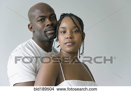Picture - Couple looking at camera. Fotosearch