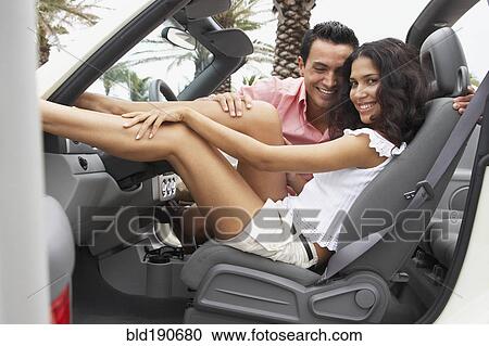 Couple sitting in car View Large Photo Image Stock Image - Couple sitting in car. Fotosearch