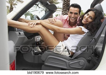 Stock Photo - Couple sitting in car. Fotosearch