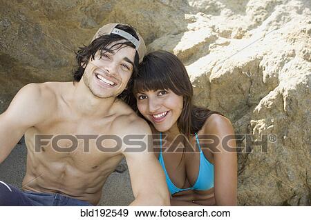 Couple sitting on beach together View Large Photo Image Stock Photo - Couple sitting on beach together. Fotosearch