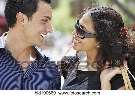Stock Photo - Couple smiling at each other. Fotosearch