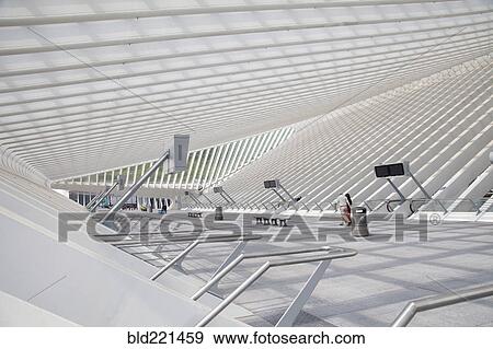 Stock Photo - Couple walking in modern train station. Fotosearch