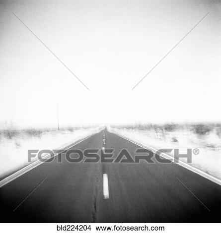 Defocused view of empty road View Large Photo Image Picture - Defocused view of empty road. Fotosearch