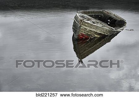 Stock Photo - Dilapidated boat in lake. Fotosearch