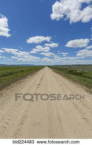 Dirt road toward mountains View Large Photo Image Stock Image - Dirt road toward mountains. Fotosearch