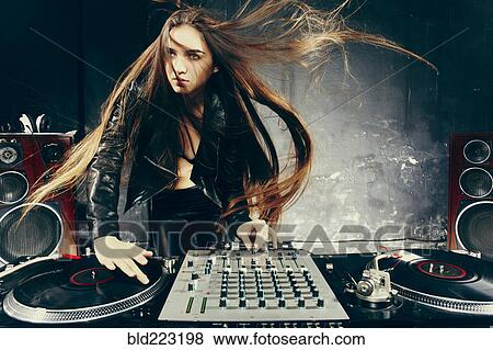 Stock Photo - Disc jockey playing music in nightclub. Fotosearch