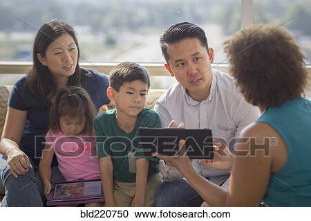 Doctor and patients using digital tablet View Large Photo Image Stock Image - Doctor and patients using digital tablet. Fotosearch