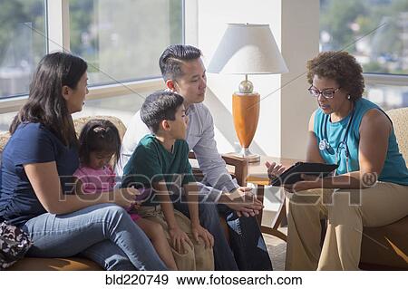 Stock Photo - Doctor and patients using digital tablet. Fotosearch