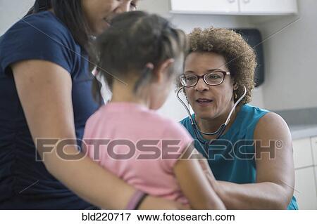 Stock Photo - Doctor listening to chest of girl. Fotosearch