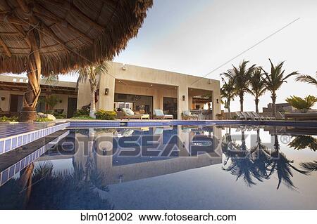 Stock Image - Elegant home and swimming pool. Fotosearch