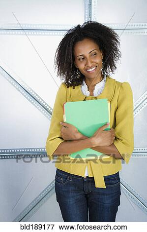 Ethiopian businesswoman holding file folders View Large Photo Image Stock Photo - Ethiopian businesswoman holding file folders. Fotosearch