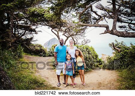 Family smiling on beach path View Large Photo Image Stock Image - Family smiling on beach path. Fotosearch