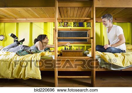 Father and daughter playing chess at camp View Large Photo Image Stock Photograph - Father and daughter playing chess at camp. Fotosearch
