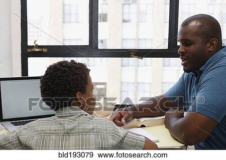Father and son doing homework View Large Photo Image Stock Photo - Father and son doing homework. Fotosearch