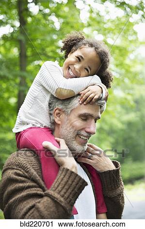 Father carrying daughter on shoulders View Large Photo Image Stock Image - Father carrying daughter on shoulders. Fotosearch