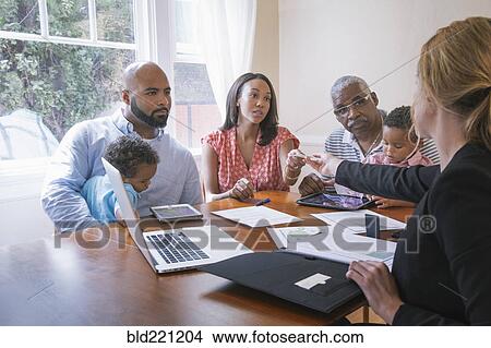 Financial advisor talking to clients View Large Photo Image Picture - Financial advisor talking to clients. Fotosearch