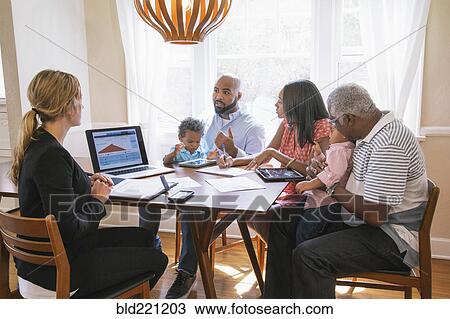 Stock Image - Financial advisor talking to clients. Fotosearch