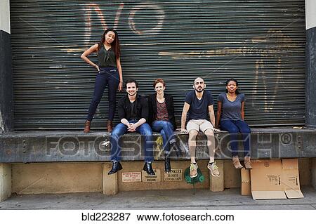 Friends posing on loading dock View Large Photo Image Stock Photo - Friends posing on loading dock. Fotosearch