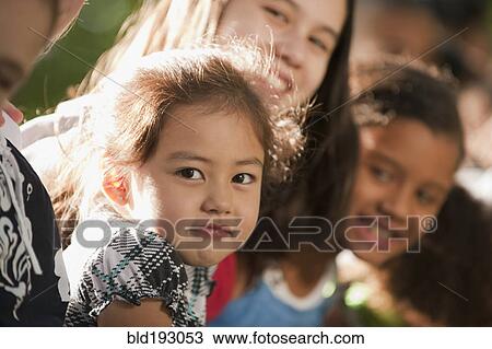Stock Image - Friends smiling. Fotosearch
