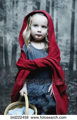 Stock Photo - Girl dressed as little red riding hood. Fotosearch