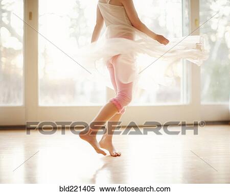 Stock Photography - Girl twirling in skirt. Fotosearch