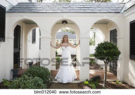 Stock Image - Glamorous Caucasian bride in wedding dress. Fotosearch