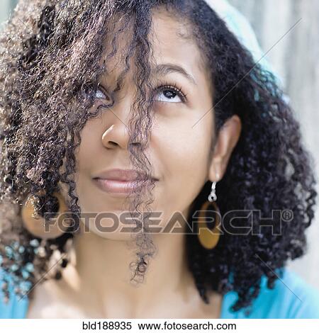 Stock Photography - Glamorous mixed race woman looking up. Fotosearch