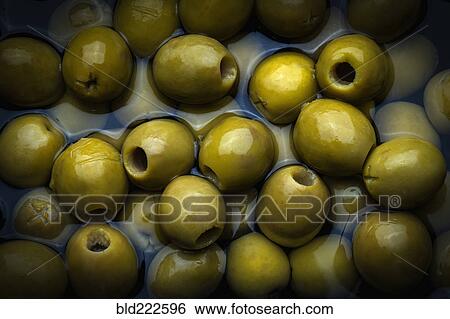 Green olives in liquid View Large Photo Image Stock Photograph - Green olives in liquid. Fotosearch
