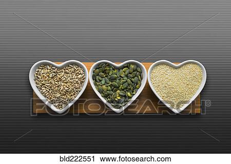 Heart-shaped bowls of heart-healthy seeds View Large Photo Image Stock Image - Heart-shaped bowls of heart-healthy seeds. Fotosearch