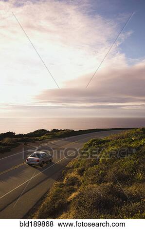 High angle view of car on coastal highway View Large Photo Image Stock Photo - High angle view of car on coastal highway. Fotosearch
