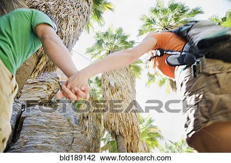 Hispanic couple hiking in tropical area View Large Photo Image Stock Image - Hispanic couple hiking in tropical area. Fotosearch