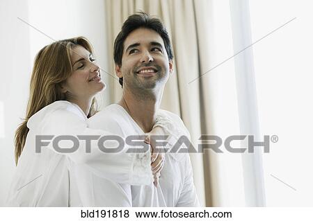 Stock Photo - Hispanic couple hugging. Fotosearch