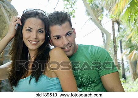 Stock Image - Hispanic couple sitting together. Fotosearch