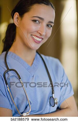Stock Photo - Hispanic doctor smiling. Fotosearch
