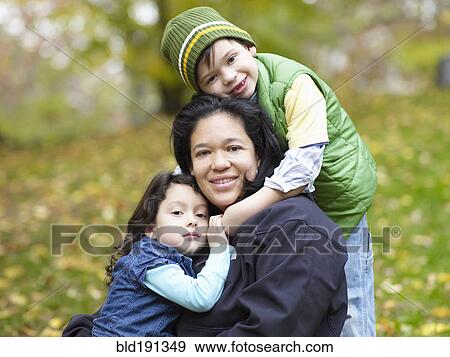 Hispanic family playing outdoors View Large Photo Image Stock Photo - Hispanic family playing outdoors. Fotosearch
