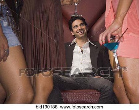 Stock Photo - Hispanic man at nightclub. Fotosearch