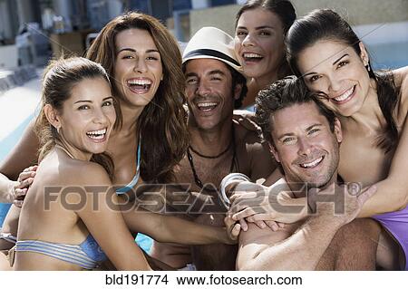 Hispanic men and women poolside View Large Photo Image Picture - Hispanic men and women poolside. Fotosearch